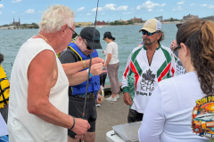 Fish being measured at the ICHA Fishing Derby weigh‑in station
