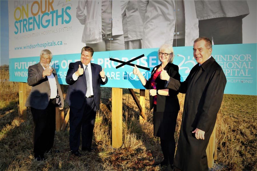 Crossing out the word “proposed” on the billboard located at the County Road 42 site of the future Windsor Essex Regional Acute Care Hospital from left are: Tom Bain, Lakeshore Mayor and Warden of Essex County; David Musyj, President & CEO of WRH; Janice Kaffer, President & CEO HDG Healthcare and David Cooke, former NDP Minister and MPP.