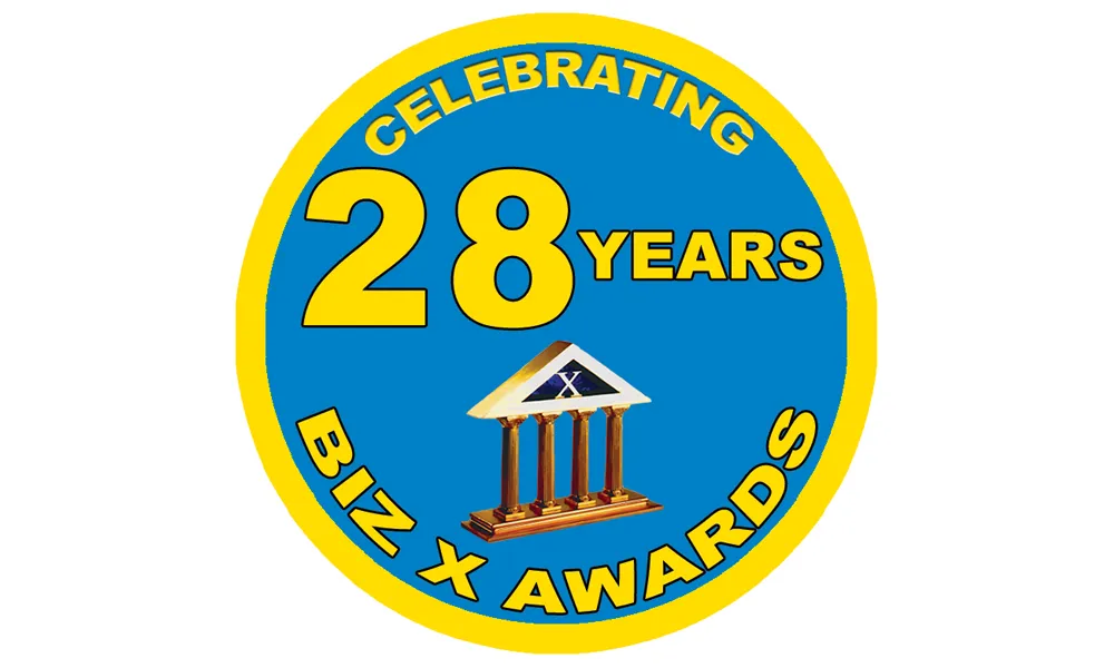 Biz X magazine 28 year badge